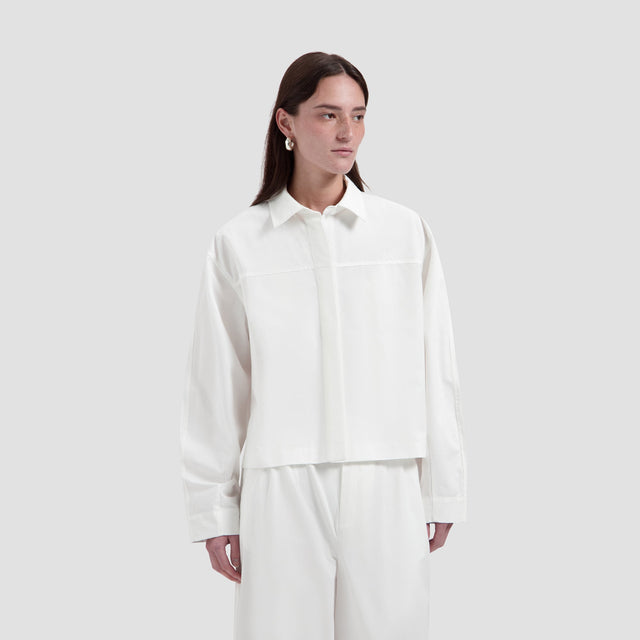 Retro Logo Boxy Shirt van OLAF HUSSEIN in de kleur wit — afbeelding 1 van 3